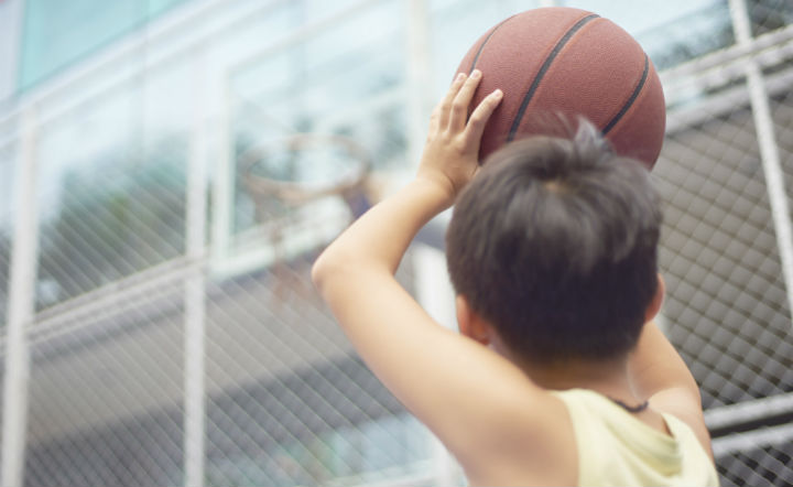 kid shooting a basketball