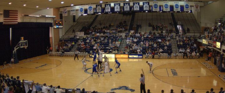 basketball game start in full indoor gym