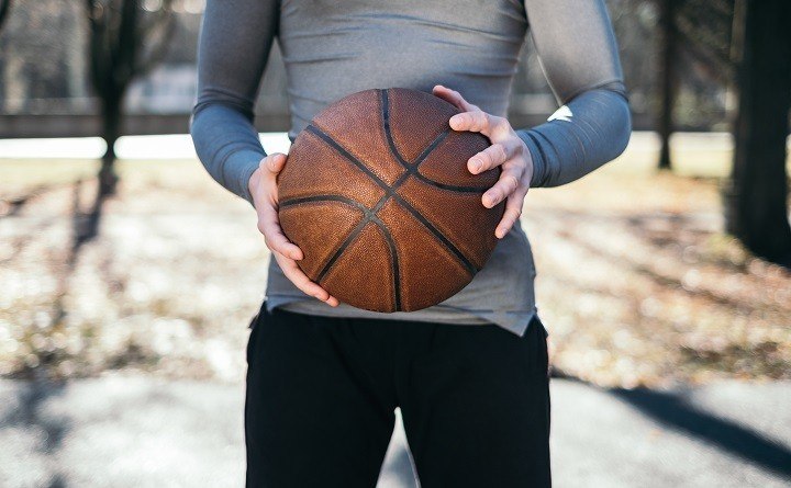 man holding basketball