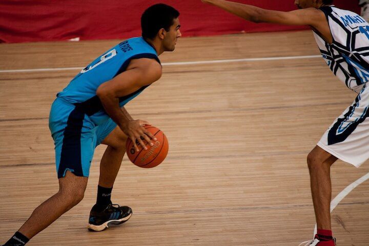 Player looks to pass and make an assist during a basketball game